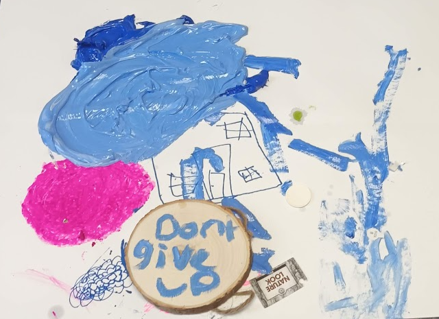 A group of blue and pink paint on a white surface AI-generated content may be incorrect.